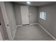 Bonus room featuring gray paint, vinyl flooring, and natural light at 4673 Sherman St, Denver, CO 80216