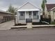 Charming single-story home with a manicured front yard and driveway at 4673 Sherman St, Denver, CO 80216