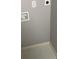 Clean laundry room with tile flooring at 4673 Sherman St, Denver, CO 80216