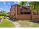 Charming townhome featuring a wooden balcony, fenced yard, and lovely stone walkway at 9427 W 89Th Cir, Broomfield, CO 80021