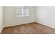 Cozy bedroom with carpeted floors and a window providing natural light at 9427 W 89Th Cir, Broomfield, CO 80021