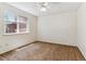 Bright bedroom with a ceiling fan and large window at 9427 W 89Th Cir, Broomfield, CO 80021