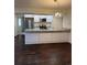 Modern kitchen features stainless steel appliances, granite countertops, and sleek white cabinets at 9427 W 89Th Cir, Broomfield, CO 80021