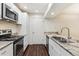 This kitchen features stainless steel appliances, granite countertops, and white cabinets at 9427 W 89Th Cir, Broomfield, CO 80021