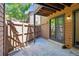 Private patio with wooden fencing and access to the home's exterior at 9427 W 89Th Cir, Broomfield, CO 80021