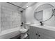 Updated bathroom with marble tile and modern vanity at 12525 E Tennessee Cir # E, Aurora, CO 80012