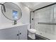 Modern bathroom with gray vanity, walk-in shower, and updated fixtures at 12525 E Tennessee Cir # E, Aurora, CO 80012
