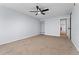 Bedroom with carpet, built-in shelving and access to hallway at 12525 E Tennessee Cir # E, Aurora, CO 80012