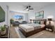 Serene bedroom boasts a comfortable bed, natural light, and stylish décor for restful nights and refreshing mornings at 12525 E Tennessee Cir # E, Aurora, CO 80012