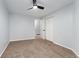 Bright bedroom with ceiling fan and neutral carpeting at 12525 E Tennessee Cir # E, Aurora, CO 80012