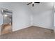 Bright bedroom with carpeted floor and ceiling fan at 12525 E Tennessee Cir # E, Aurora, CO 80012