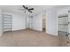 Bright bedroom with carpet, walk-in closet, and ensuite bathroom at 12525 E Tennessee Cir # E, Aurora, CO 80012