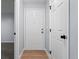 Spacious entryway with white door and wood-look flooring at 12525 E Tennessee Cir # E, Aurora, CO 80012