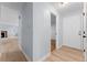 Bright entryway with white door and wood-look flooring at 12525 E Tennessee Cir # E, Aurora, CO 80012