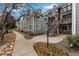 Well-maintained building exterior with neat landscaping and private entrances offers a welcoming curb appeal at 12525 E Tennessee Cir # E, Aurora, CO 80012