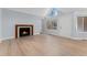 Living room with fireplace and hardwood floors at 12525 E Tennessee Cir # E, Aurora, CO 80012