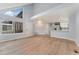 Open concept living room with hardwood floors and kitchen at 12525 E Tennessee Cir # E, Aurora, CO 80012