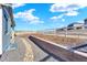 Well-maintained backyard features a white fence, landscaping, and retaining wall at 1982 Peralta Loop, Castle Rock, CO 80104