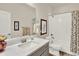 Elegant bathroom features a modern vanity with white countertop and full tub and shower at 1982 Peralta Loop, Castle Rock, CO 80104