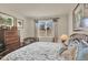 Comfortable bedroom features ample natural light, bedside tables, and a view to the neighborhood at 1982 Peralta Loop, Castle Rock, CO 80104