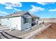 Charming single-story home showcasing a well-manicured gravel yard, white fencing, and inviting outdoor space at 1982 Peralta Loop, Castle Rock, CO 80104