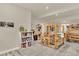 Spacious hobby room with shelves and weaving looms on light gray carpet over wood floors at 1982 Peralta Loop, Castle Rock, CO 80104