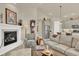 Open-concept living room connects to the kitchen and boasts fireplace and comfortable seating at 1982 Peralta Loop, Castle Rock, CO 80104