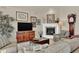 Cozy living room features a fireplace, large television, comfortable seating and attractive decor at 1982 Peralta Loop, Castle Rock, CO 80104