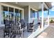 Relax on this covered patio with comfortable gray seating, perfect for enjoying the outdoors at 1982 Peralta Loop, Castle Rock, CO 80104