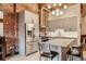 Modern kitchen featuring stainless steel appliances, gray wood cabinets, and a stylish island at 2960 Inca St # 404, Denver, CO 80202