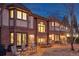 Brick home features an expansive backyard patio area with ample seating and outdoor dining space at 5 Tamarade Dr, Littleton, CO 80127