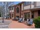 An expansive backyard patio featuring outdoor seating areas, perfect for relaxation and entertainment at 5 Tamarade Dr, Littleton, CO 80127
