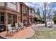 Home boasts a large patio with stylish outdoor seating and manicured landscaping at 5 Tamarade Dr, Littleton, CO 80127