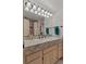 Bathroom featuring granite counters, a long vanity, and a view into the shower at 5 Tamarade Dr, Littleton, CO 80127