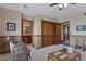 Bedroom featuring an ensuite bathroom, large wardrobe and chess set at 5 Tamarade Dr, Littleton, CO 80127