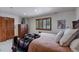 Bedroom featuring shutters, a dresser and a comfortable bed at 5 Tamarade Dr, Littleton, CO 80127