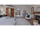 Spacious bedroom with fireplace and large doorway with view of the soaking tub at 5 Tamarade Dr, Littleton, CO 80127