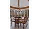 Dining room with a large round table surrounded by windows offering ample natural light at 5 Tamarade Dr, Littleton, CO 80127