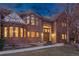 Attractive brick home with a unique turret design, complemented by a well-maintained lawn and inviting walkway at 5 Tamarade Dr, Littleton, CO 80127