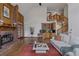 Open living room with a fireplace, a spiral staircase, and a wet bar for entertaining at 5 Tamarade Dr, Littleton, CO 80127