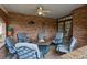 Covered patio with a brick surround and a gas fire pit providing a cozy outdoor space at 5 Tamarade Dr, Littleton, CO 80127