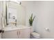 Modern bathroom with stylish vanity, mirror, and fixtures; flooded with natural light at 2589 Arapahoe St, Denver, CO 80205