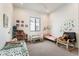 Spacious playroom with twin beds, a rocking chair, and a cozy atmosphere at 2589 Arapahoe St, Denver, CO 80205