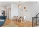 Dining area featuring modern table and chairs, with stylish lighting and hardwood floors at 2589 Arapahoe St, Denver, CO 80205