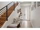 Welcoming entryway with stylish bench seating, modern staircase, and bright, airy design at 2589 Arapahoe St, Denver, CO 80205