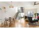 Bright, open-concept living room with modern staircase, hardwood floors, and ample natural light at 2589 Arapahoe St, Denver, CO 80205