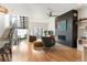 Spacious living room featuring fireplace, hardwood floors, and an abundance of natural light at 2589 Arapahoe St, Denver, CO 80205