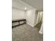 Finished basement area featuring neutral walls and carpet, and a long desk at 345 S Forest St, Denver, CO 80246
