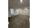 Finished basement area featuring neutral walls and carpet, and two windows at 345 S Forest St, Denver, CO 80246