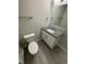 Bathroom with gray countertop and white cabinets and tile flooring at 345 S Forest St, Denver, CO 80246
